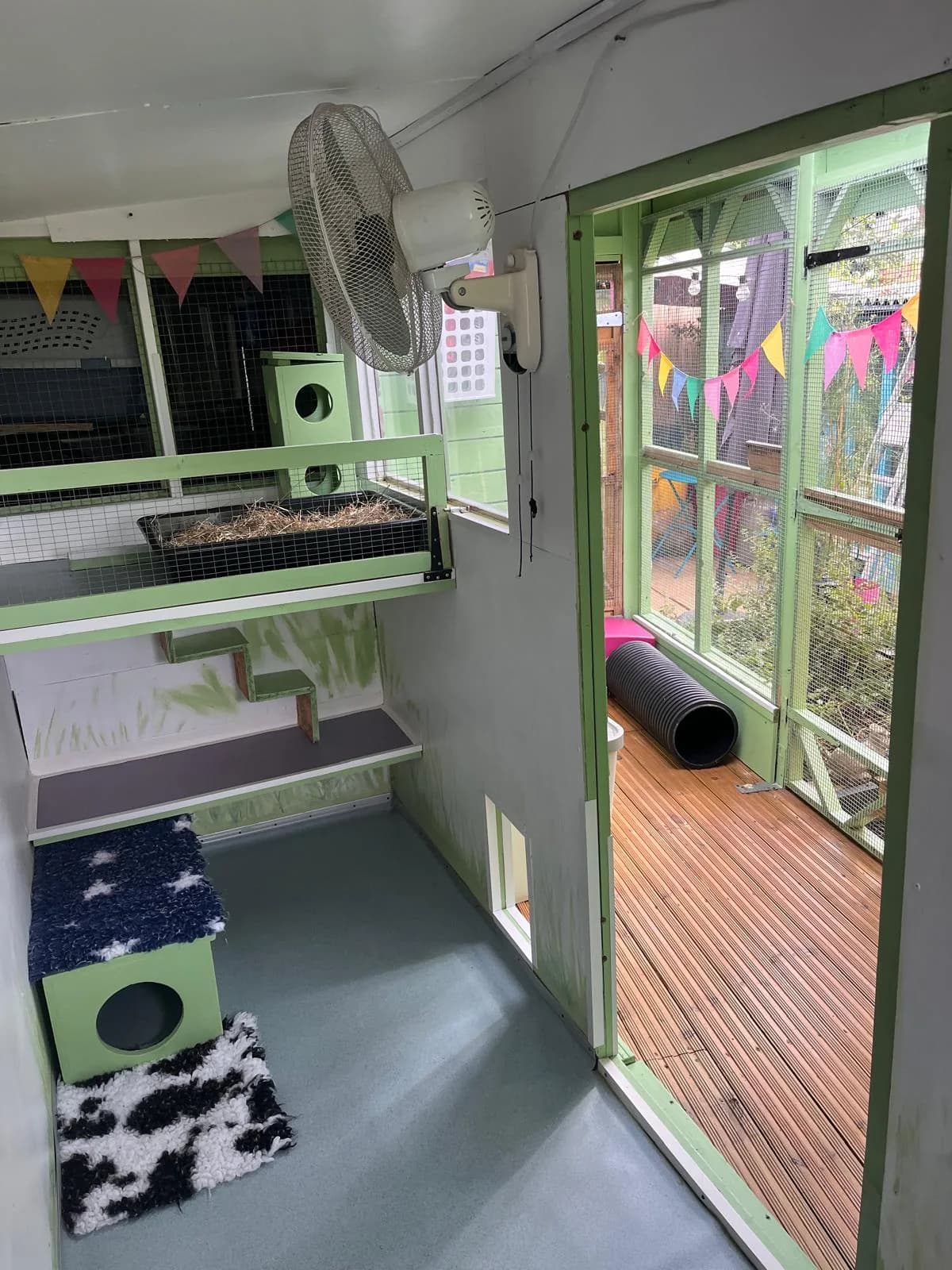 Apple Tree Lodge pod with a railed snooze shelf, ramps and the open doorway to its decked run