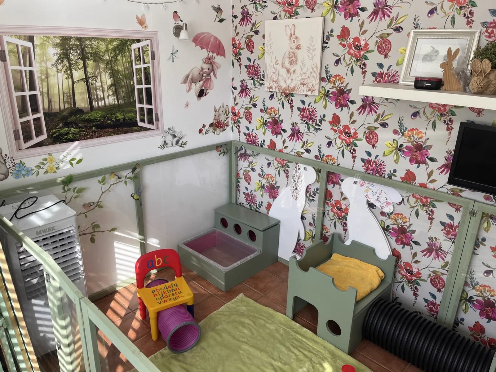 Indoor Bunny Room with its painted window, castle hideaways and tiled floor