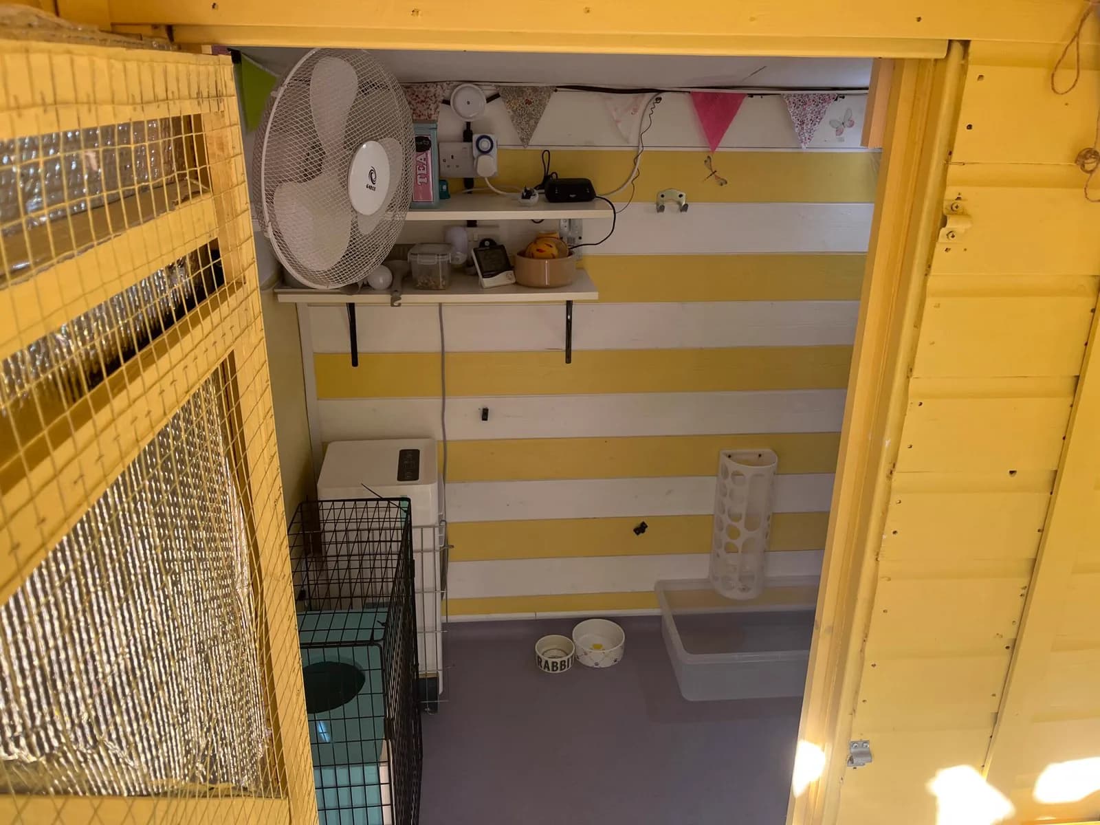 Lemon Tree Lodge wall-mounted fan and monitored interior above the lower floor